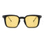 Black-framed sunglasses with yellow lenses on a white background