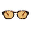 Sunglasses with tortoiseshell frame and amber lenses on a white background