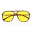 Sunglasses with yellow lenses and tortoiseshell frame on a white background