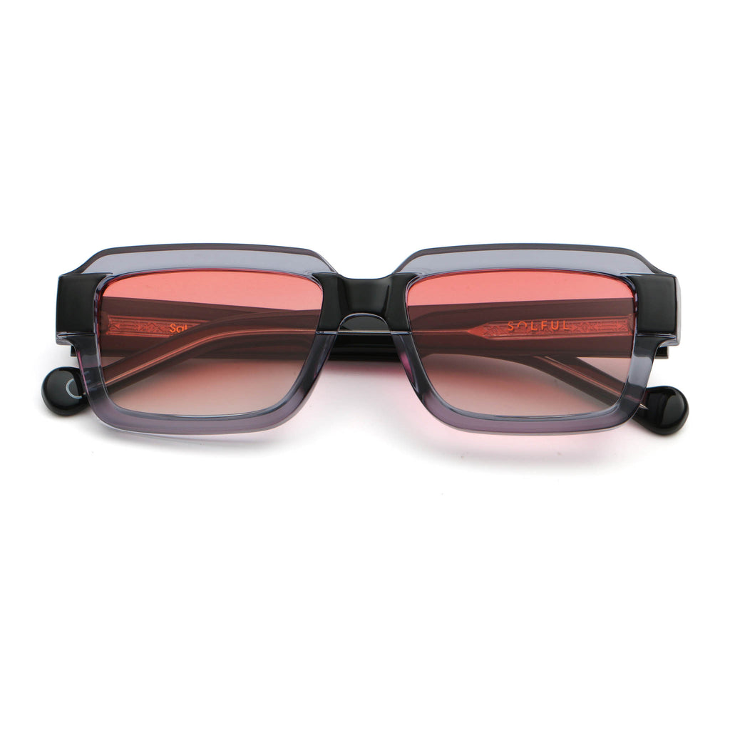 Sunglasses with red-tinted lenses on a white background