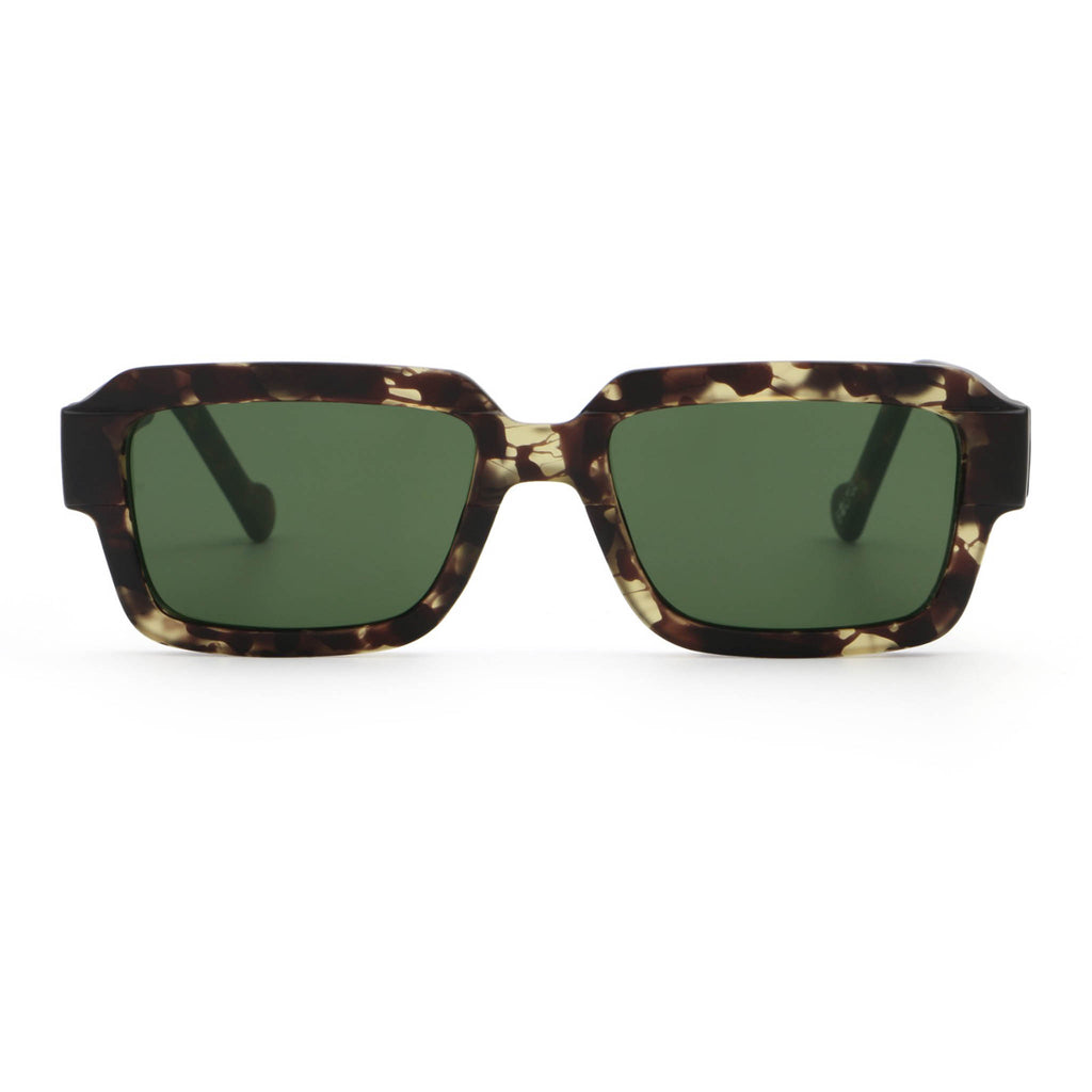 Sunglasses with tortoiseshell frame and green lenses on a white background
