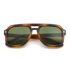 Sunglasses with tortoiseshell frame and green lenses on a white background