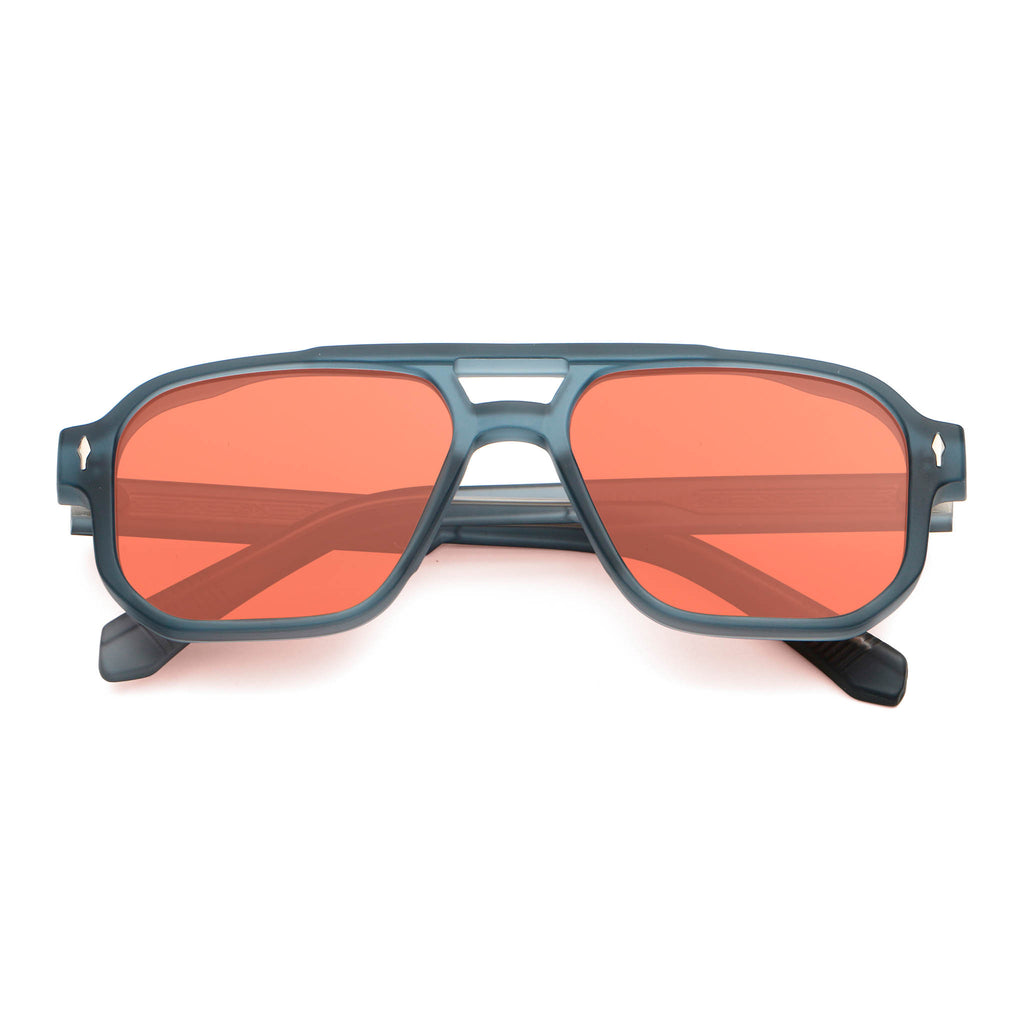 Sunglasses with red lenses and blue frame on a white background