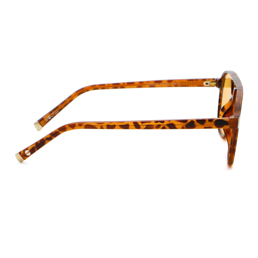 Sunglasses with tortoiseshell frame and yellow lenses on a white background.