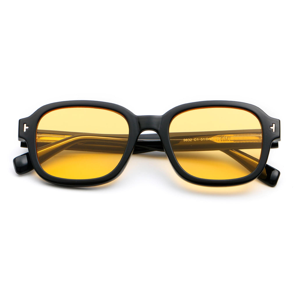 Sunglasses with a black square frame design, and yellow lenses, on white background.
