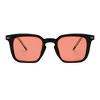 Sunglasses with black frame and red lenses on a white background.