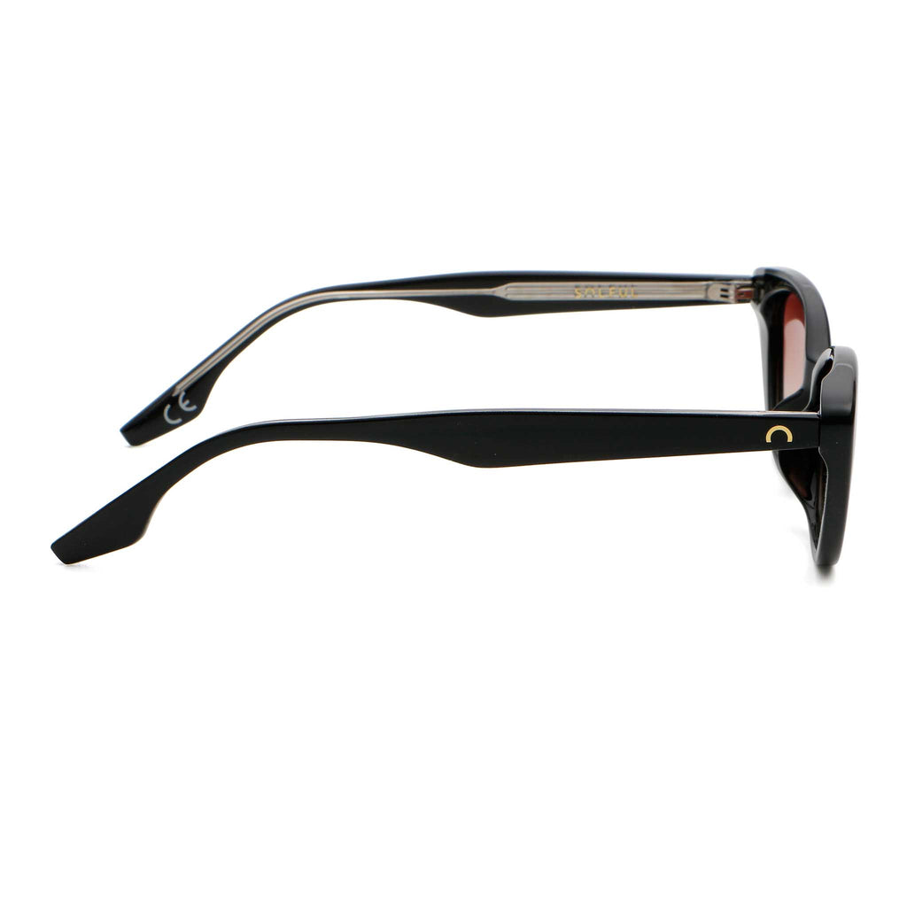 Black sunglasses with pink lenses on a white background