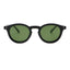 Black sunglasses with green lenses on a white background