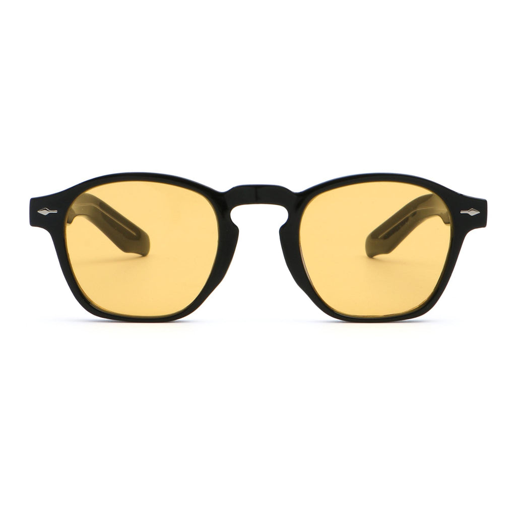 Sunglasses with yellow lenses and black frames on a white background