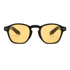 Sunglasses with yellow lenses and black frames on a white background