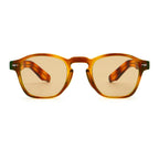 Sunglasses with tortoiseshell frame and brown lenses on a white background