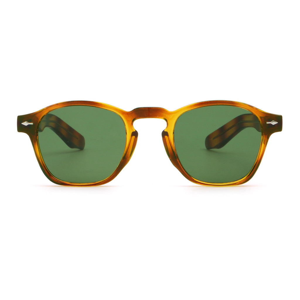 Sunglasses with tortoiseshell frame and green lenses on a white background