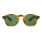 Sunglasses with tortoiseshell frame and green lenses on a white background