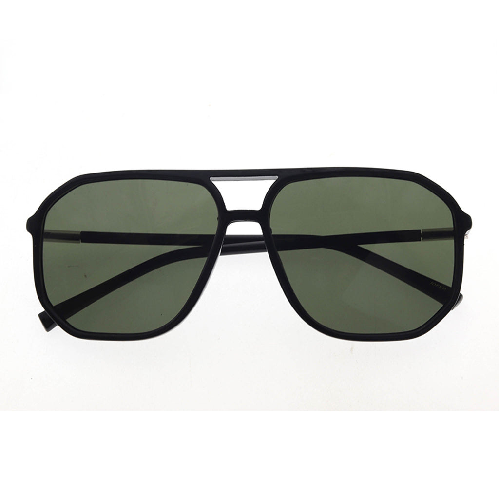 Black sunglasses with green lenses on a white background