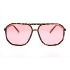 Sunglasses with tortoise print frame and pink lenses on a white background