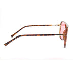 Sunglasses with tortoise frame and pink lenses on a white background