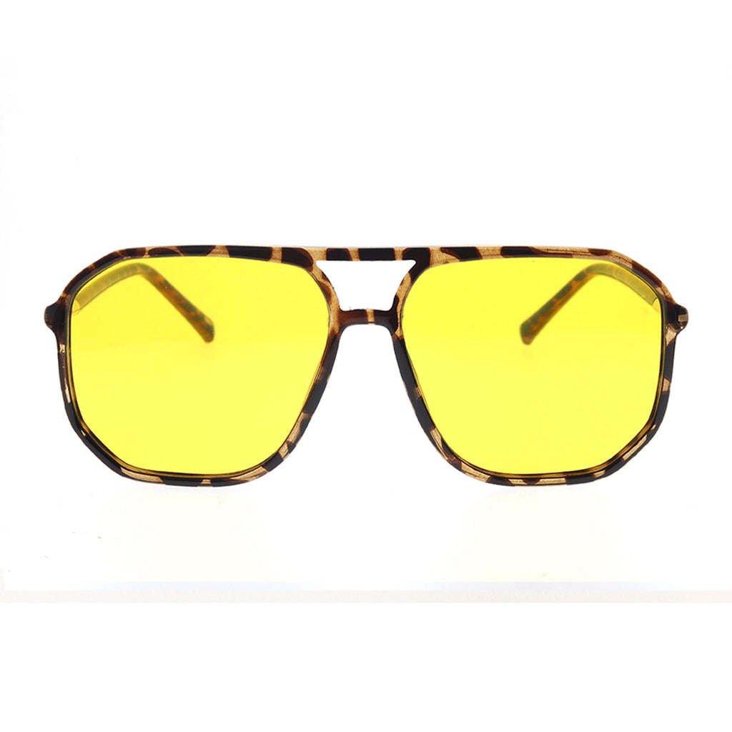 Sunglasses with yellow lenses and tortoiseshell frame on a white background