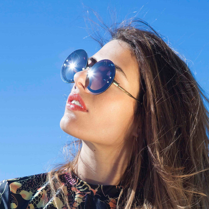 Beautiful Women wear MYSTIQUE Blue round sunglasses by SOLFUL Ibiza
